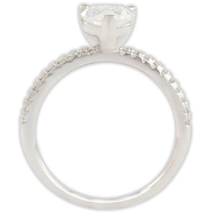 Side profile of white gold moissanite ring showing raised heart-shaped centre stone and band setting