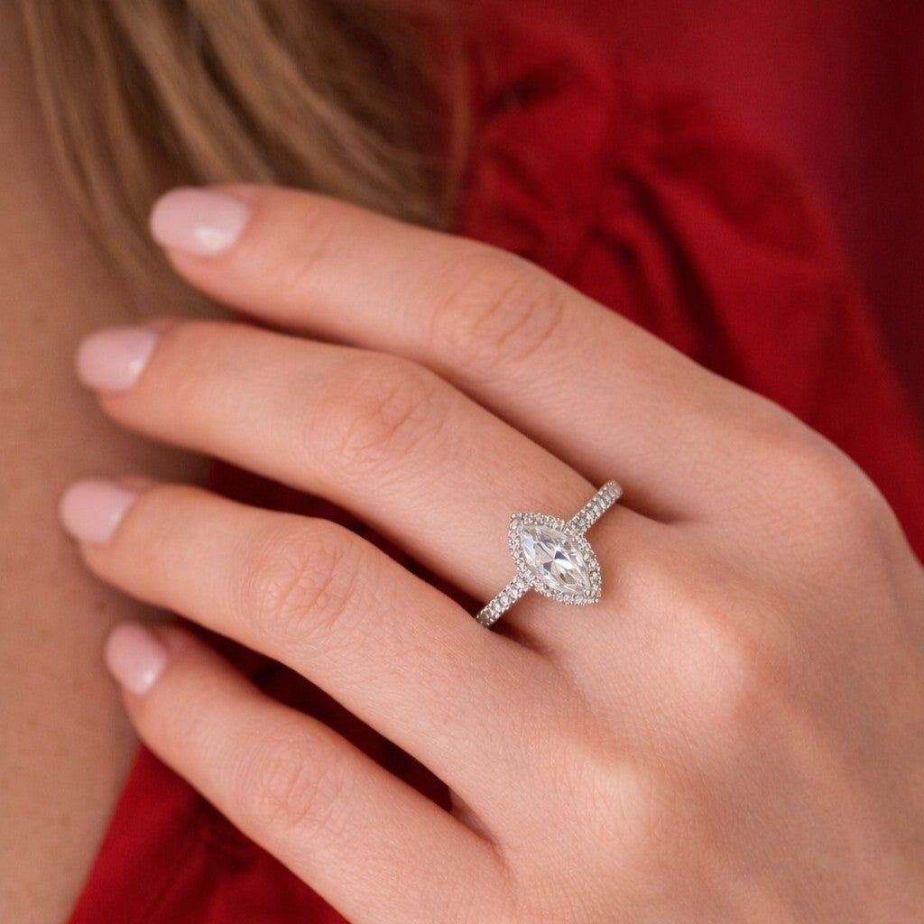 Close up of women's hand wearing White Gold 1ct Marquise Moissanite Slimline Dazzle Ring