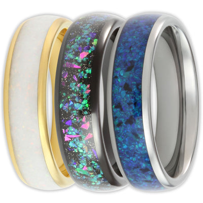 three tungsten scratch-resistant rings with a white, black and blue opal inlay 