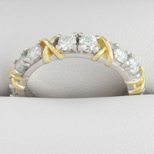 Detailed close up of white gold eternity ring with 3ct moissanite stones in a full circle band design