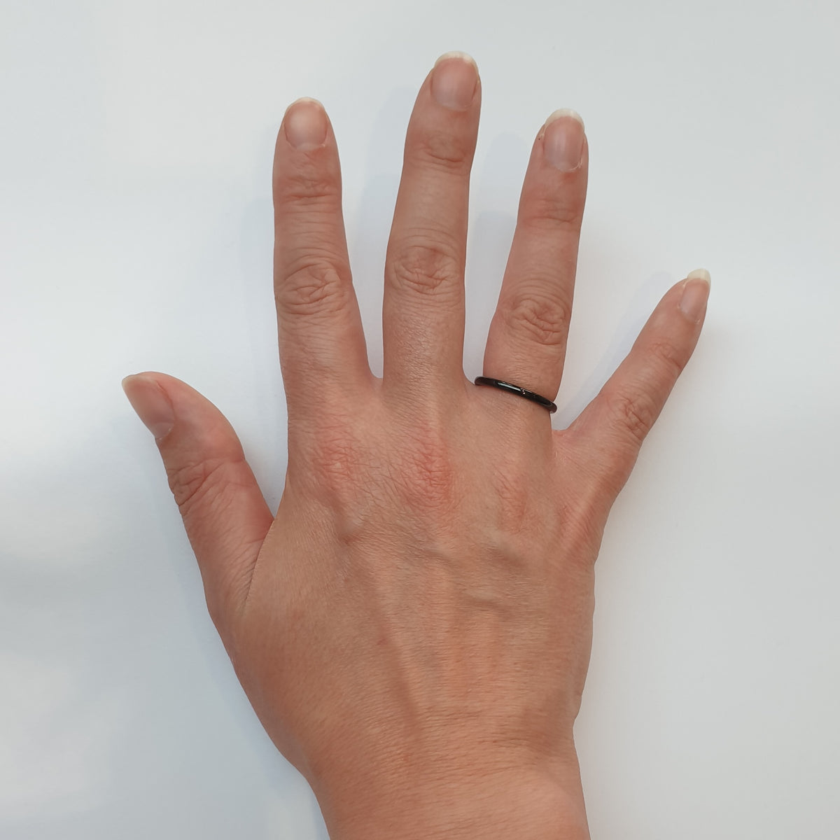 Black 2mm Wonder Ring on Hand